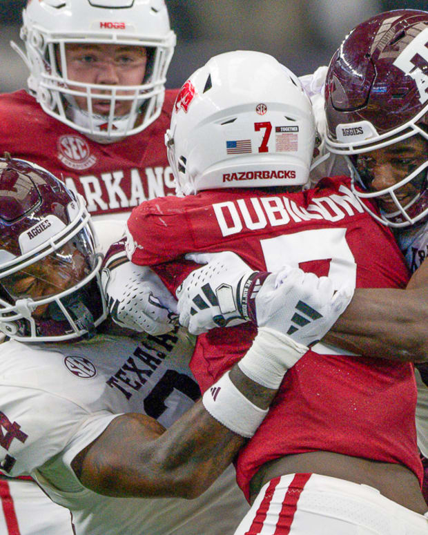 Razorbacks running back Rashod Dubinion wrapped up by Texas A&M